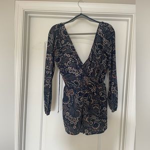 Floral long sleeve romper. Size medium.
